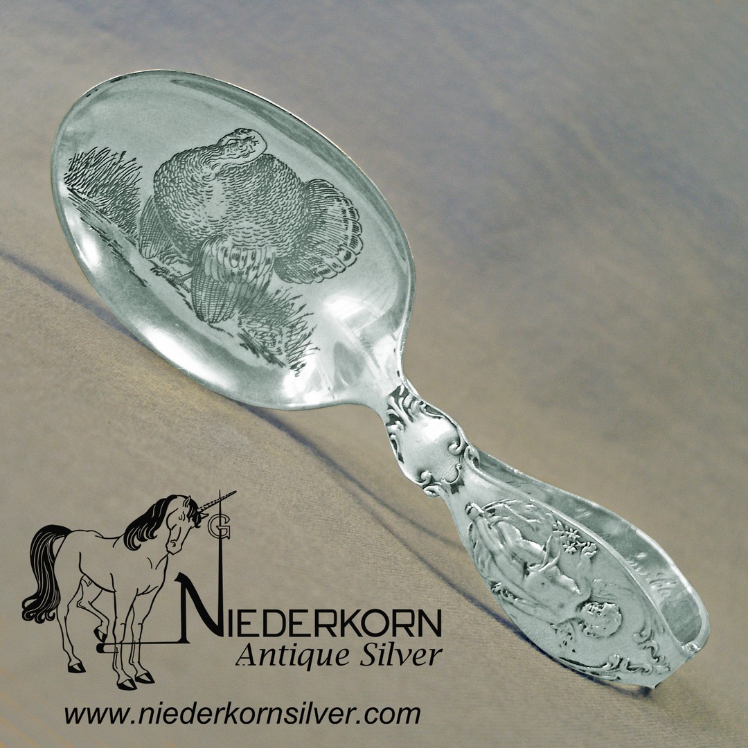 Loop baby spoon in sterling silver.